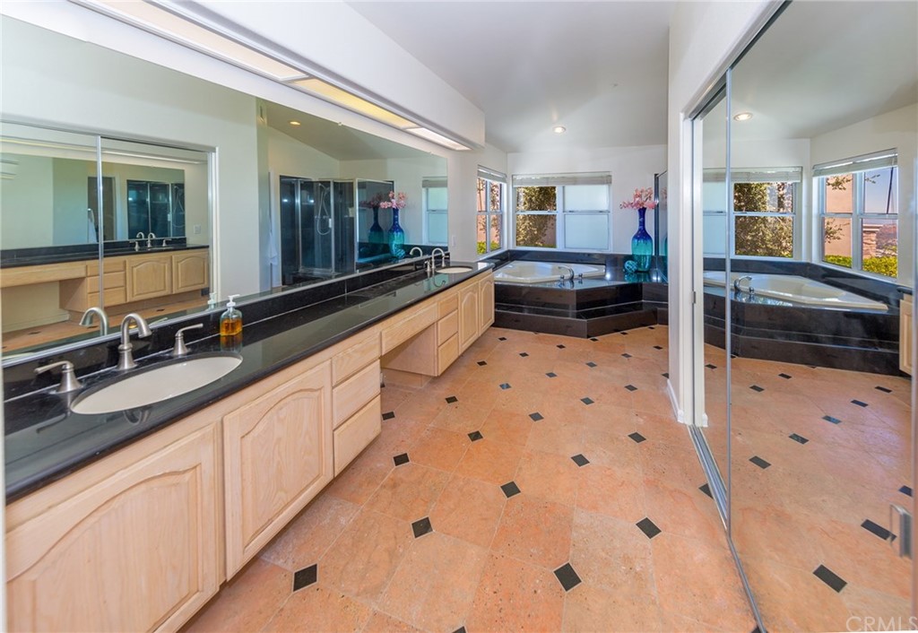 3834 Sky View Lane La Crescenta, CA 91214 - Photo 25 of 38 a large white kitchen with stainless steel appliances a sink and a large window