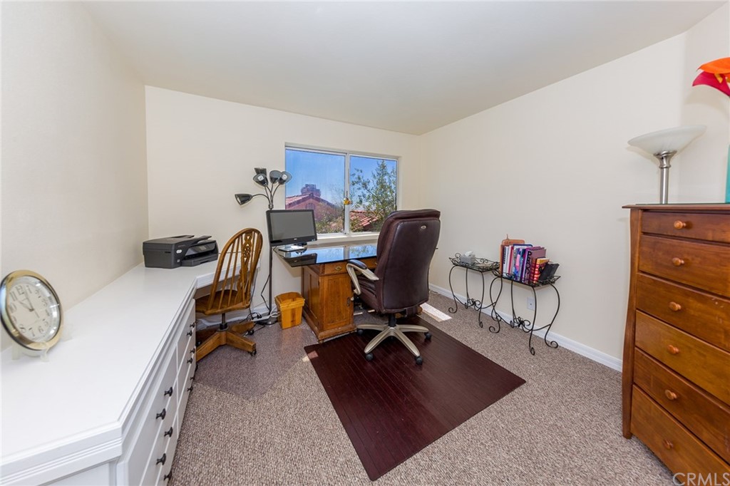 3834 Sky View Lane La Crescenta, CA 91214 - Photo 27 of 38 a view of a workspace with furniture and a window