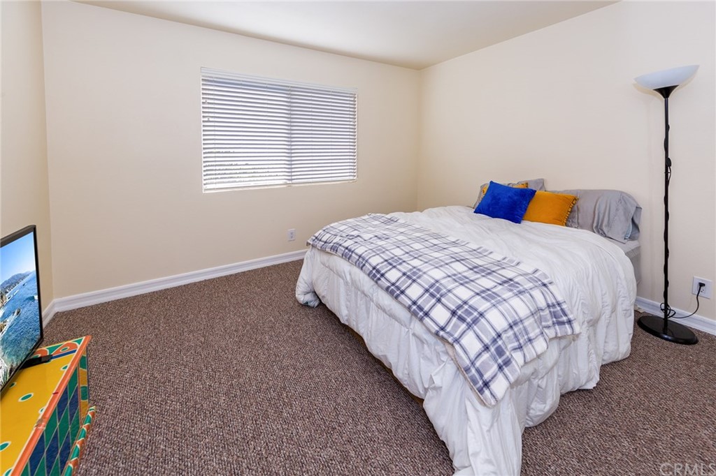 3834 Sky View Lane La Crescenta, CA 91214 - Photo 28 of 38 a spacious bedroom with a bed and a window