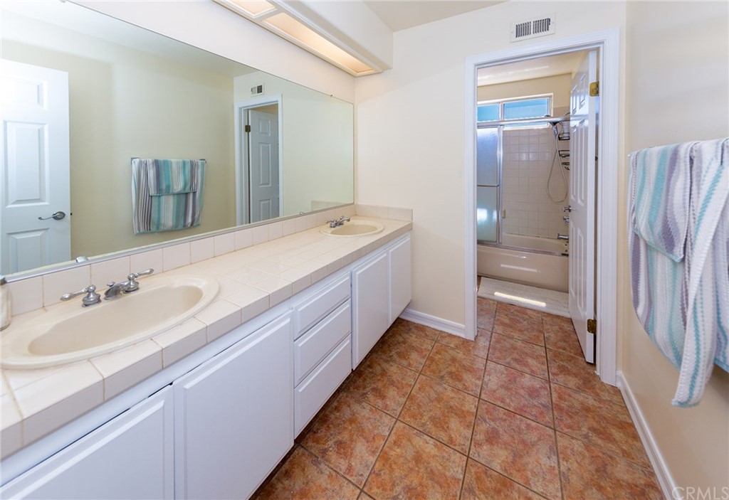 3834 Sky View Lane La Crescenta, CA 91214 - Photo 29 of 38 a spacious bathroom with a double vanity sink and a mirror