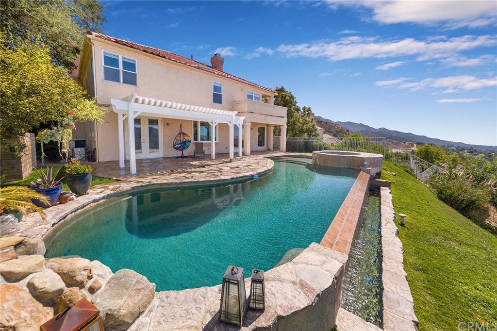 3834 Sky View Lane La Crescenta, CA 91214 - Photo 32 of 38 a front view of a house with a yard table and chairs