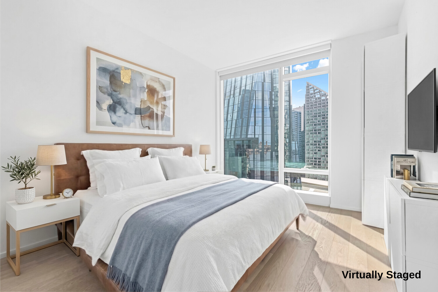 30 Riverside Boulevard, Unit 21M Manhattan, NY 10069 - Photo 5 of 38 a bedroom with a large bed and a large window