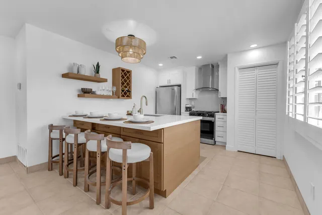 a kitchen with a sink and a refrigerator