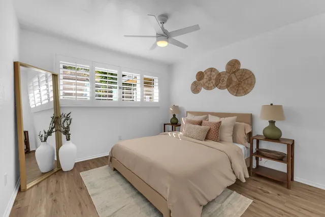 a bedroom with a bed and window