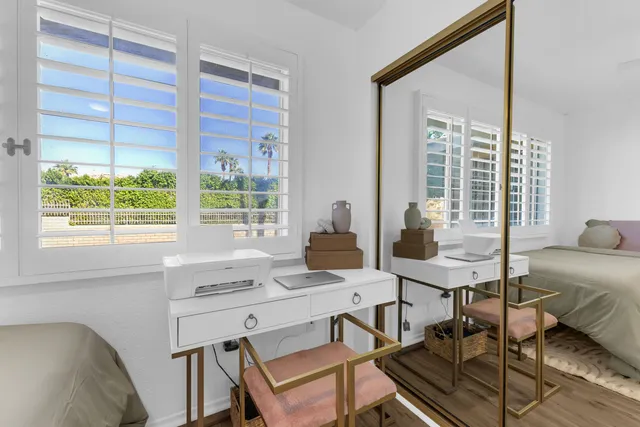 a workspace with furniture and a window