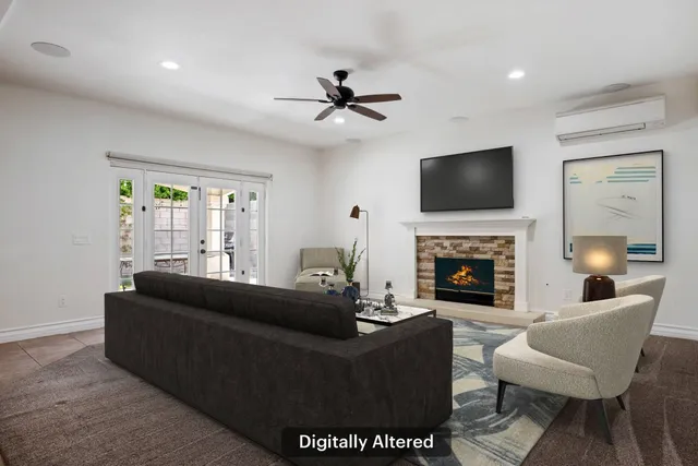 a living room with furniture a fireplace and a flat screen tv