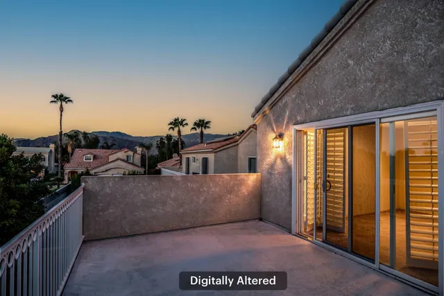 a view of a living room and a balcony