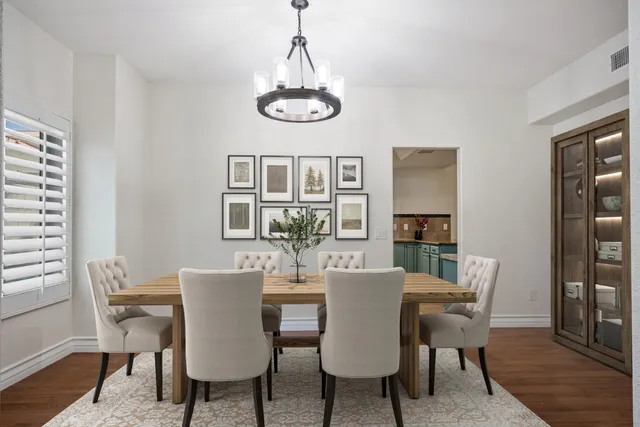 a view of a dining room with furniture window and wooden floor