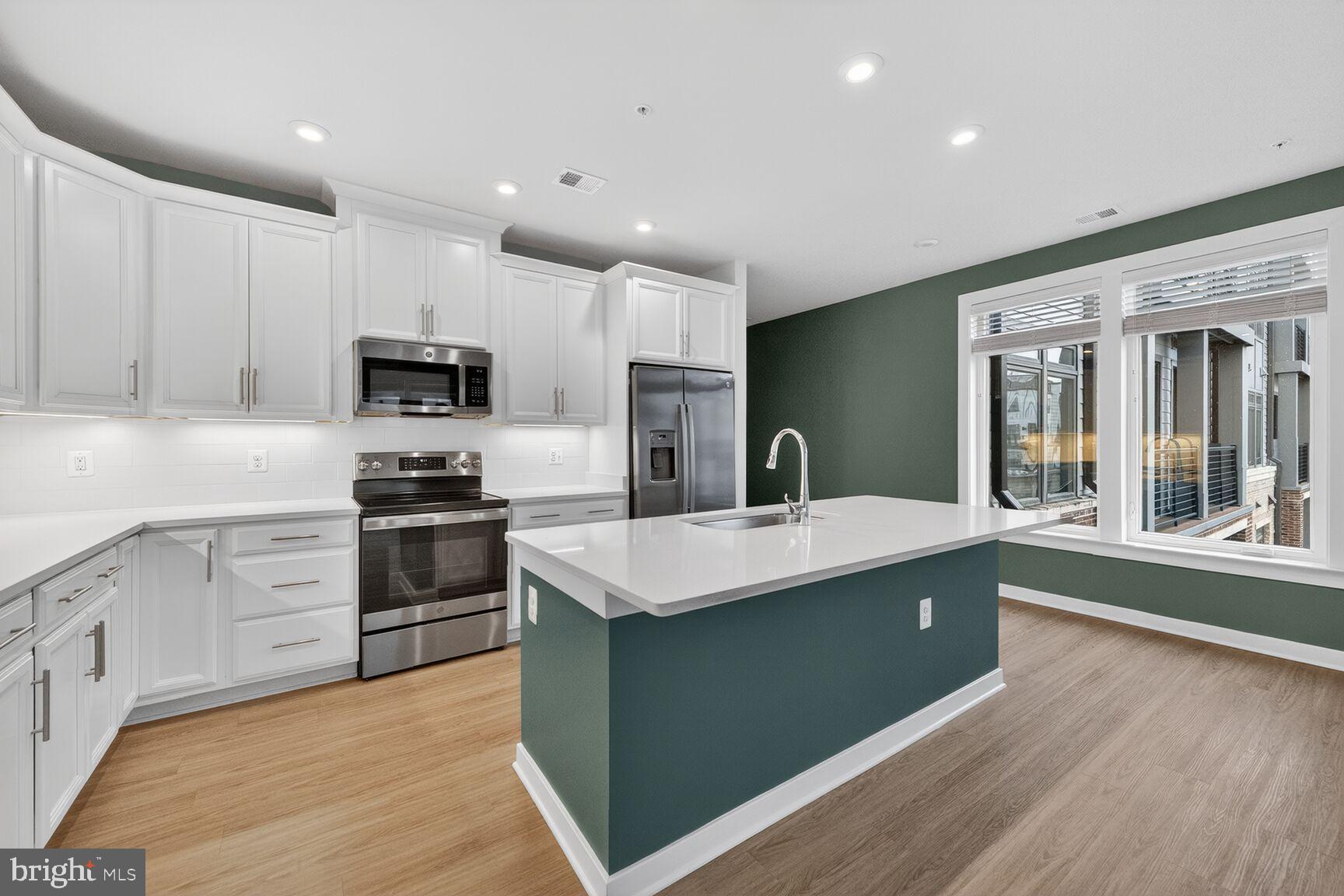 1669 Bandit Loop, Unit 301A Reston, VA 20190 - Photo 11 of 30 Modern kitchen with sleek finishes and light.