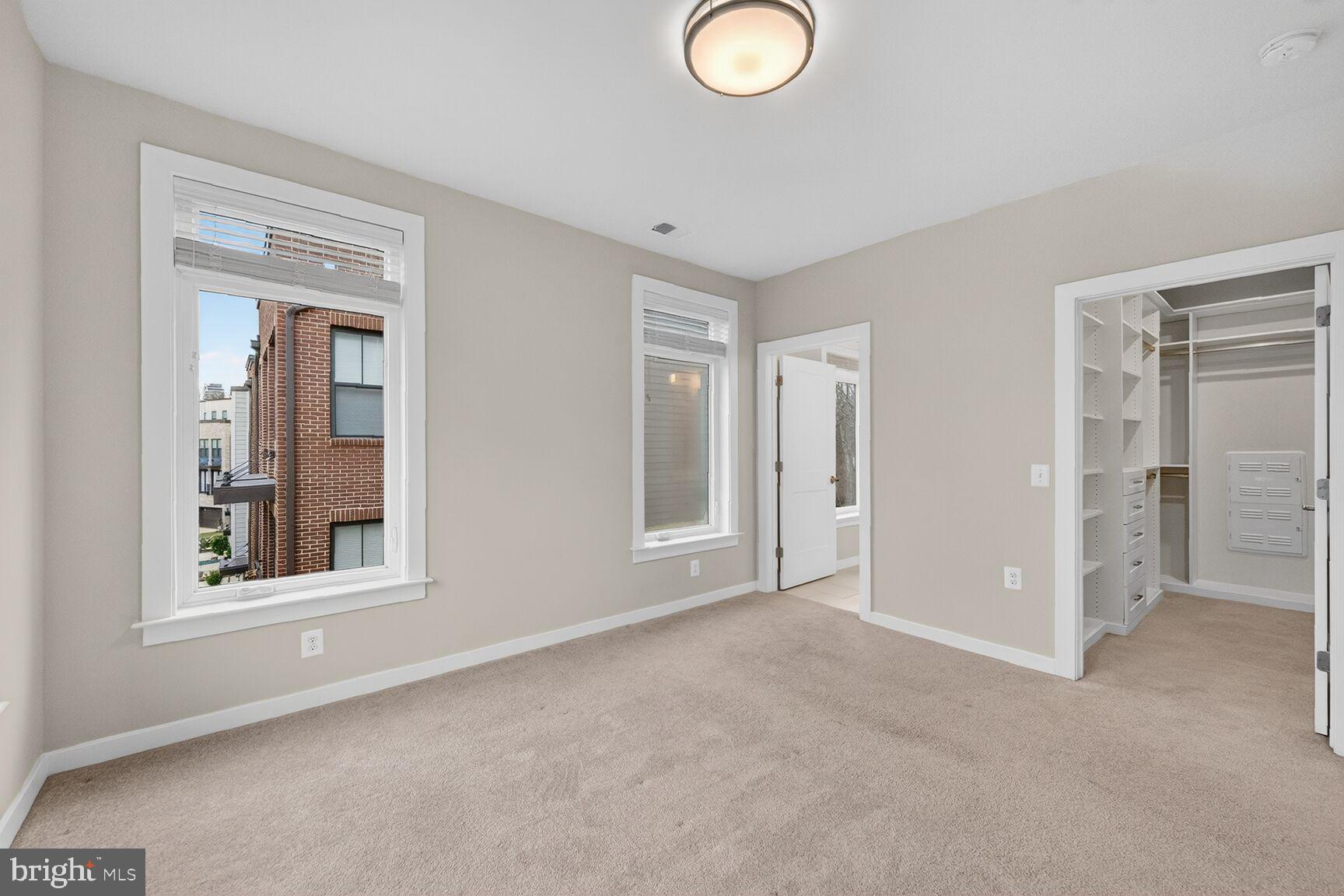 1669 Bandit Loop, Unit 301A Reston, VA 20190 - Photo 13 of 30 Bright primary bedroom with ample natural light.