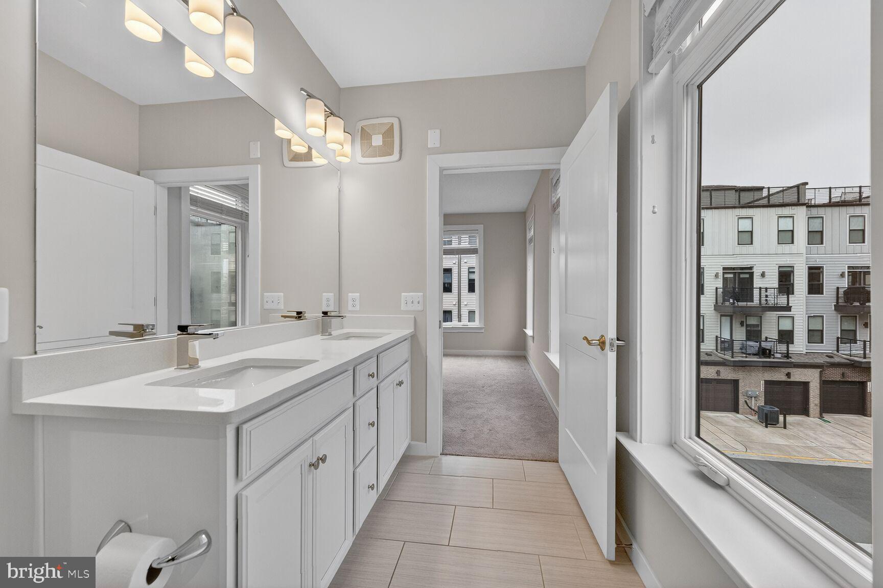 1669 Bandit Loop, Unit 301A Reston, VA 20190 - Photo 18 of 30 Bright modern primary bathroom retreat.
