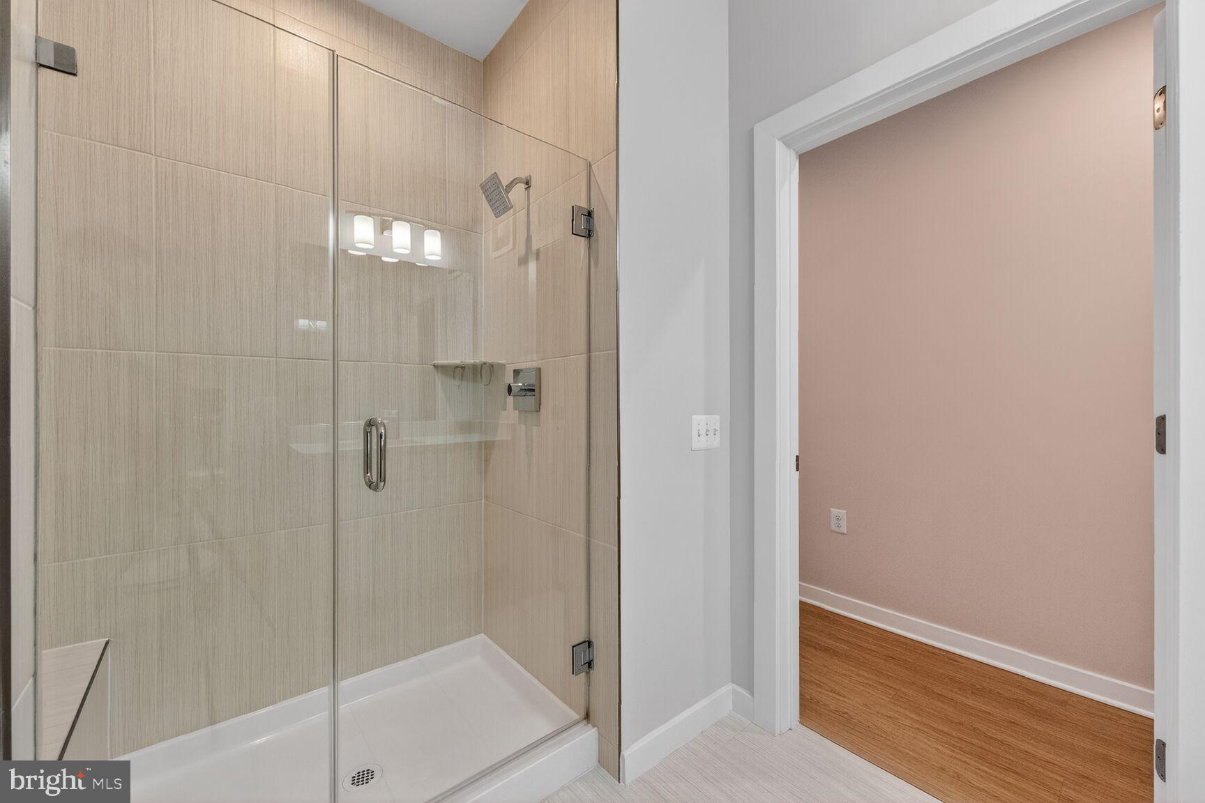 1669 Bandit Loop, Unit 301A Reston, VA 20190 - Photo 24 of 30 Sleek modern shower with elegant finishes.