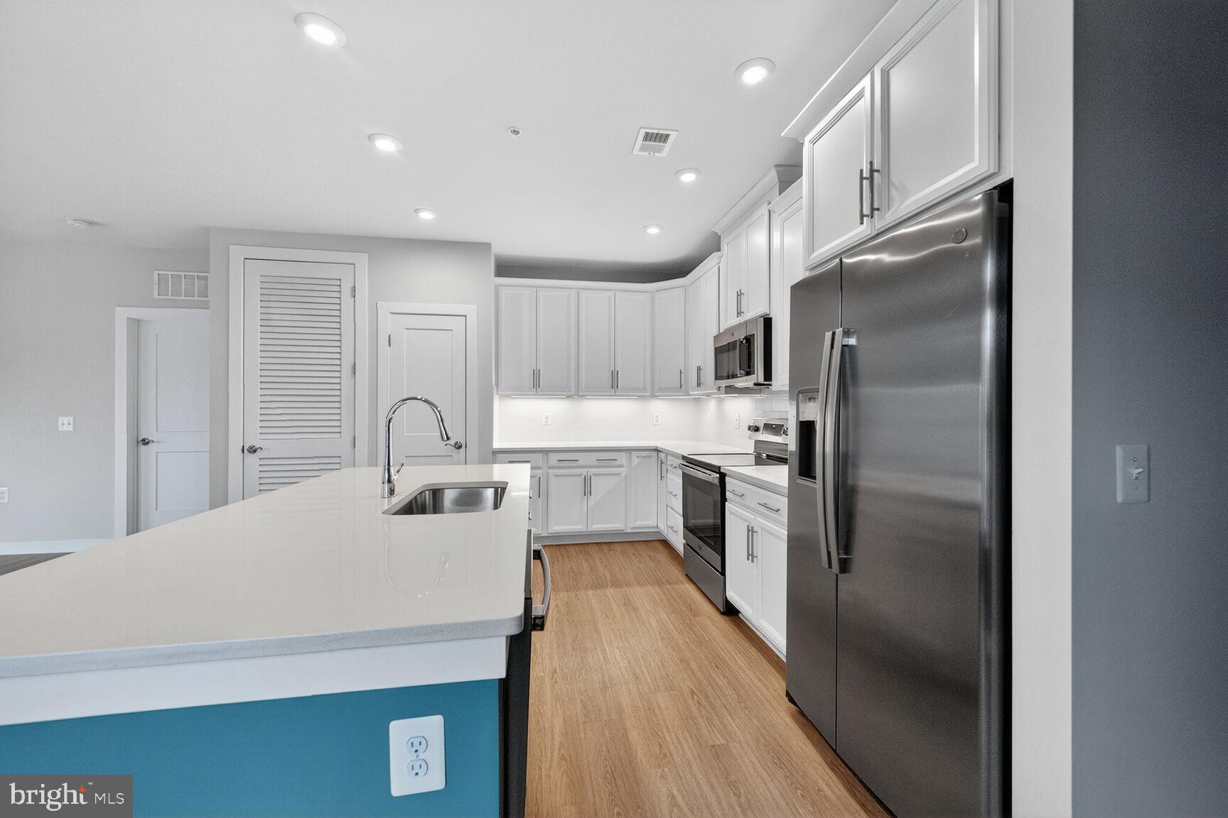 1669 Bandit Loop, Unit 301A Reston, VA 20190 - Photo 10 of 30 Modern kitchen with sleek finishes.