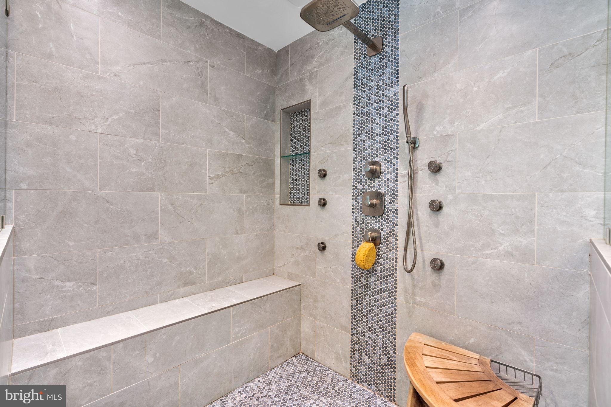 8061 Hunterbrooke Lane Fulton, MD 20759 - Photo 31 of 77 Sleek modern shower with elegant tiles.
