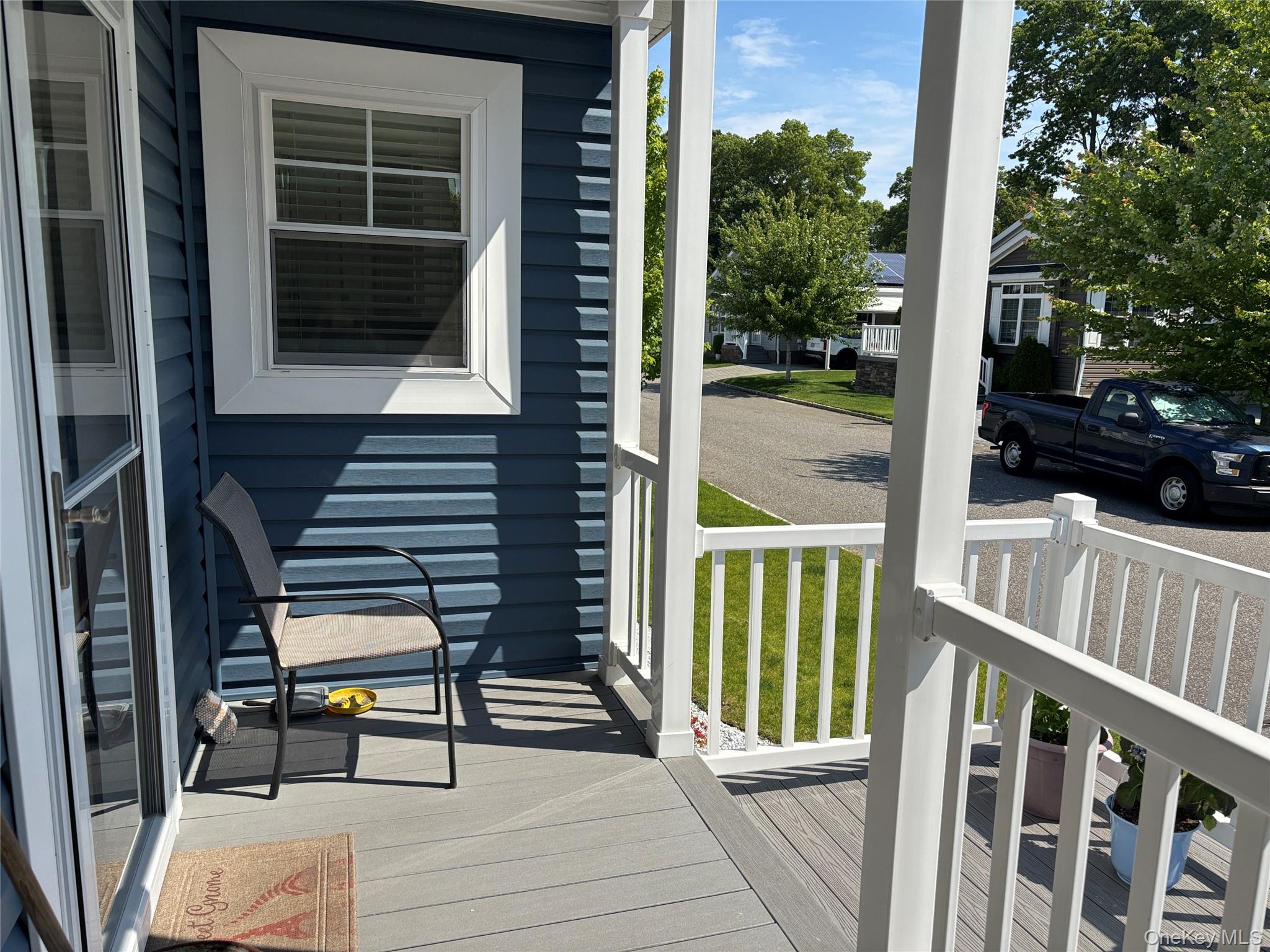 1661 Old Country Road, Unit 563 Riverhead, NY 11901 - Photo 5 of 43 a view of a two chairs and table in the balcony