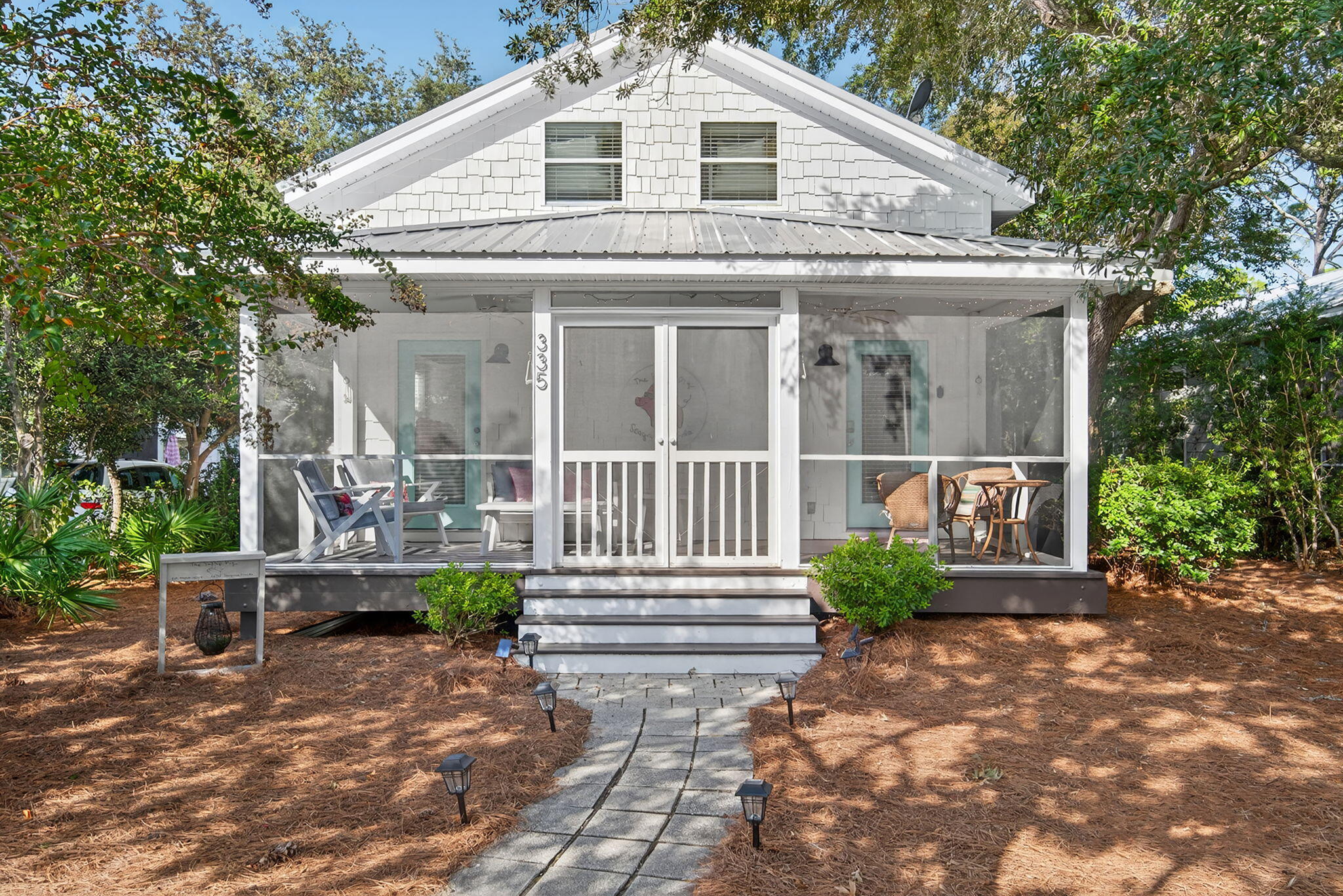 335 San Juan Avenue Santa Rosa Beach, FL 32459 - Photo 2 of 39 a front view of a house with porch