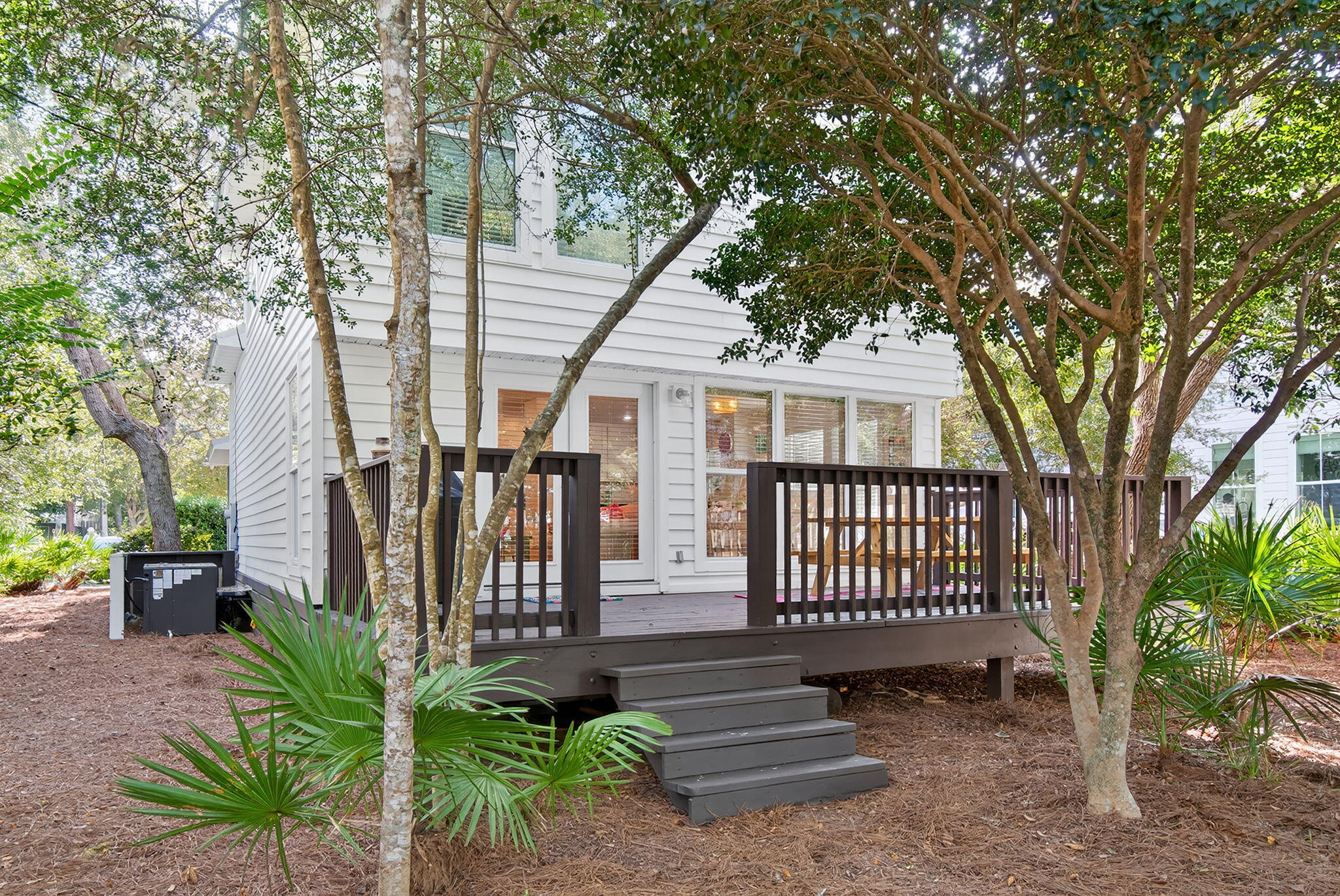 335 San Juan Avenue Santa Rosa Beach, FL 32459 - Photo 31 of 39 a view of a house with a small yard and furniture