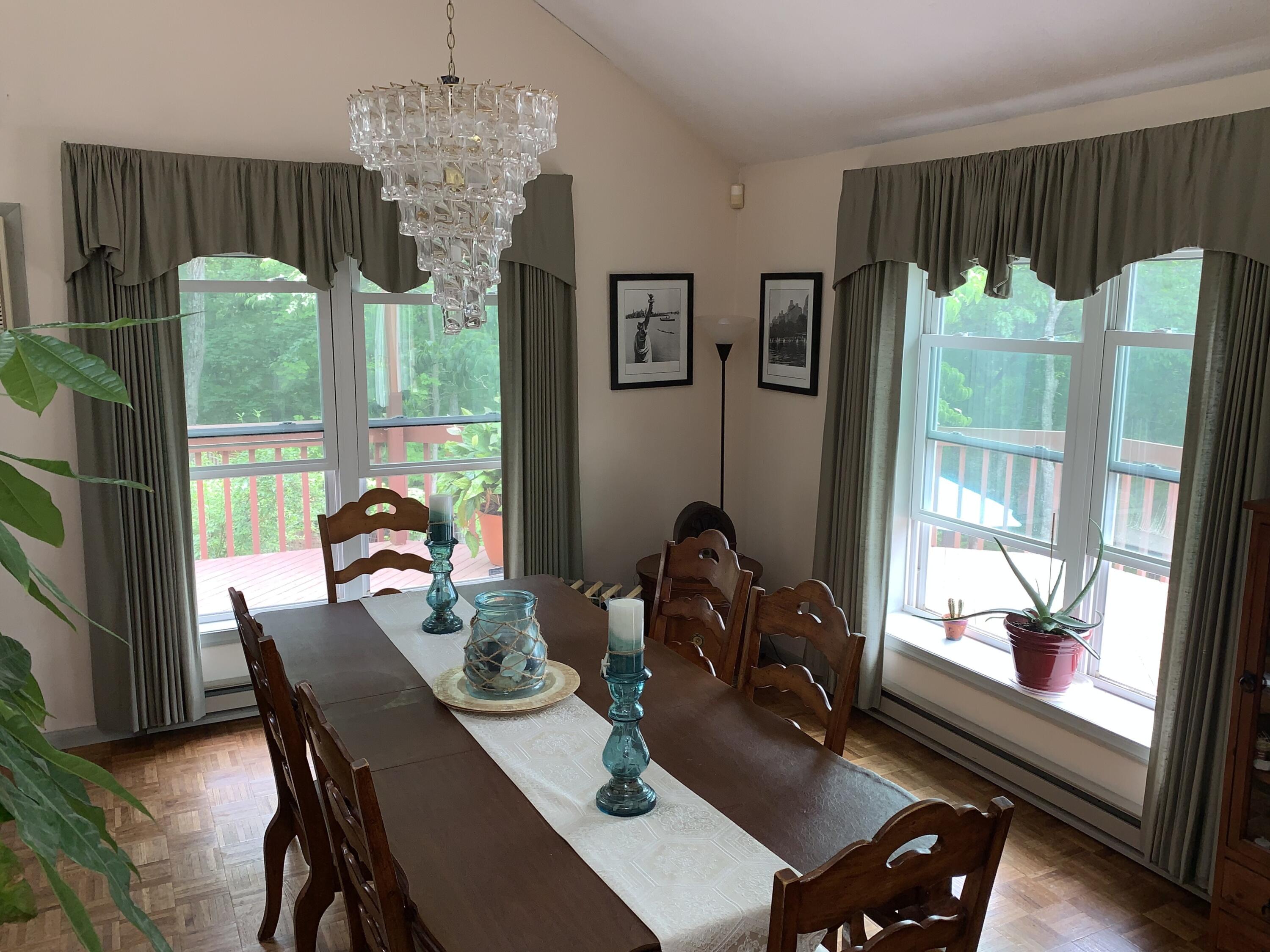 3205 Ely Court Bushkill, PA 18324 - Photo 14 of 80 a view of a dining room with furniture large window and outside view