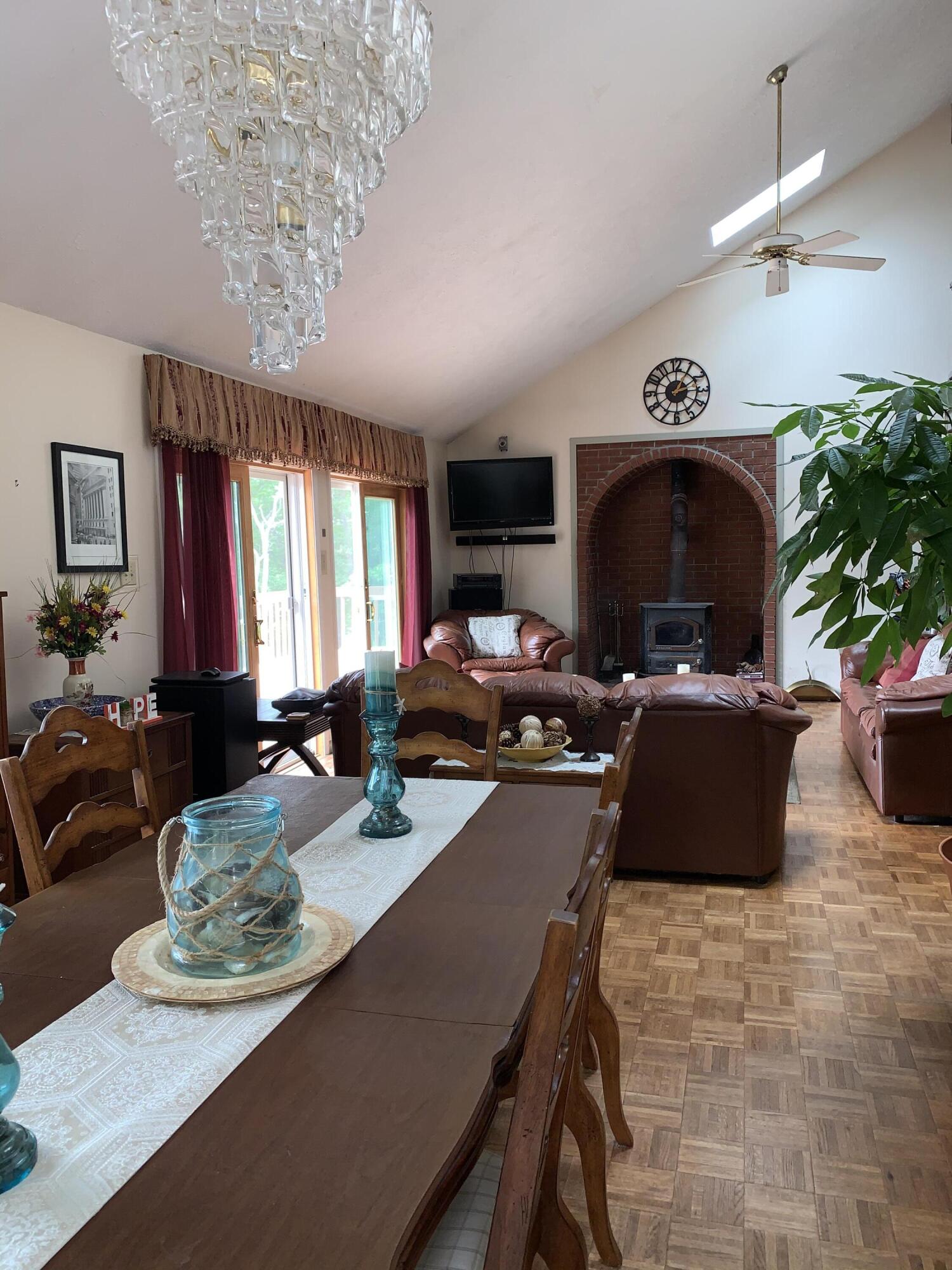 3205 Ely Court Bushkill, PA 18324 - Photo 16 of 80 a view of a dining room with furniture a chandelier and window