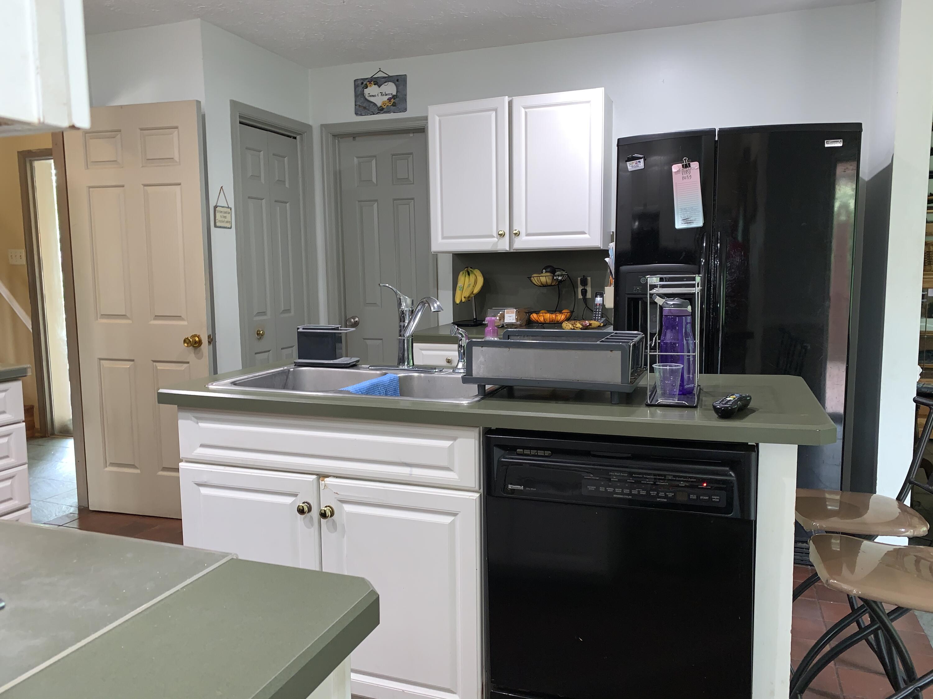 3205 Ely Court Bushkill, PA 18324 - Photo 20 of 80 a kitchen with granite countertop a refrigerator stove and microwave