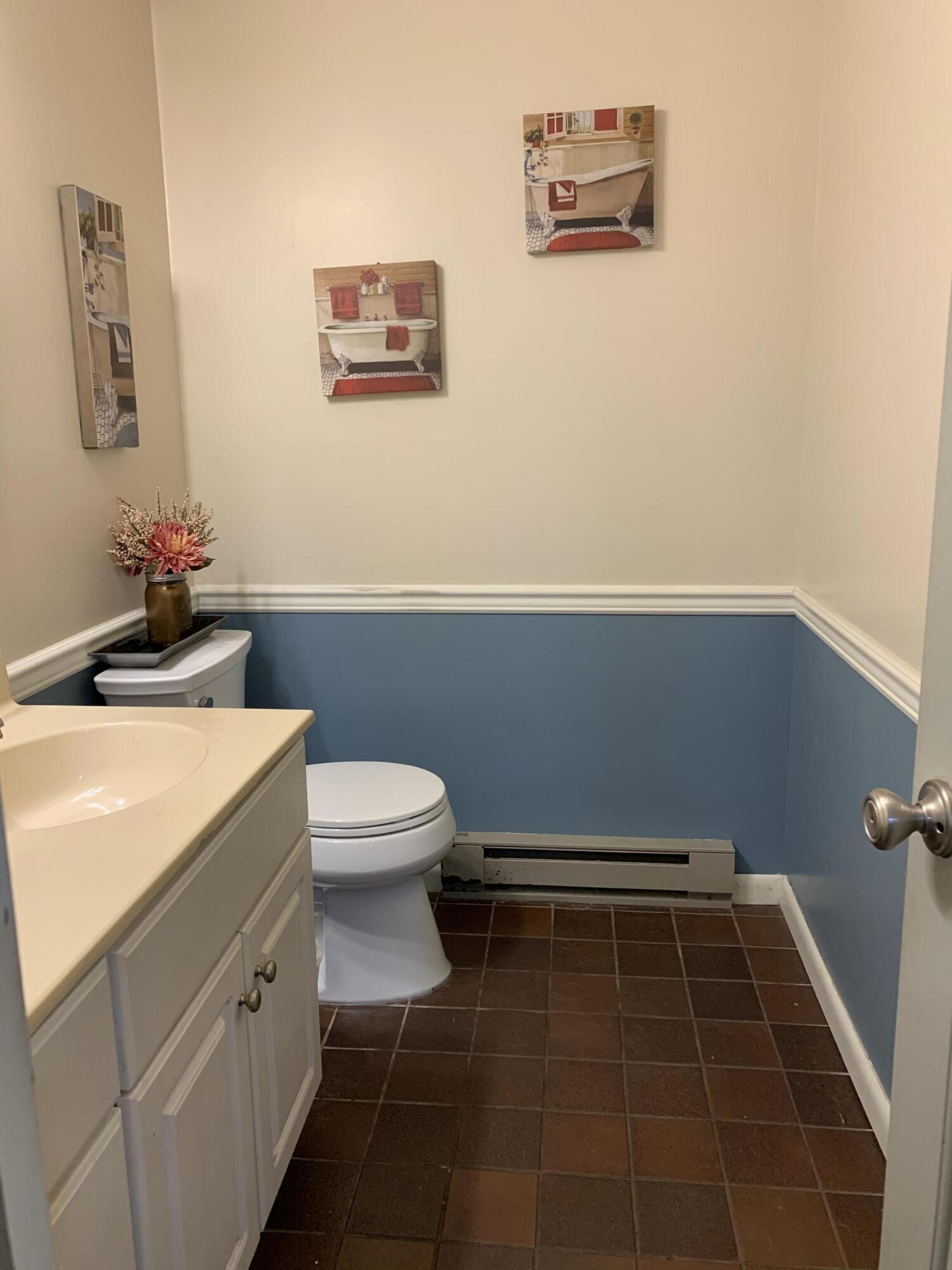 3205 Ely Court Bushkill, PA 18324 - Photo 31 of 80 a bathroom with a toilet a sink and vanity