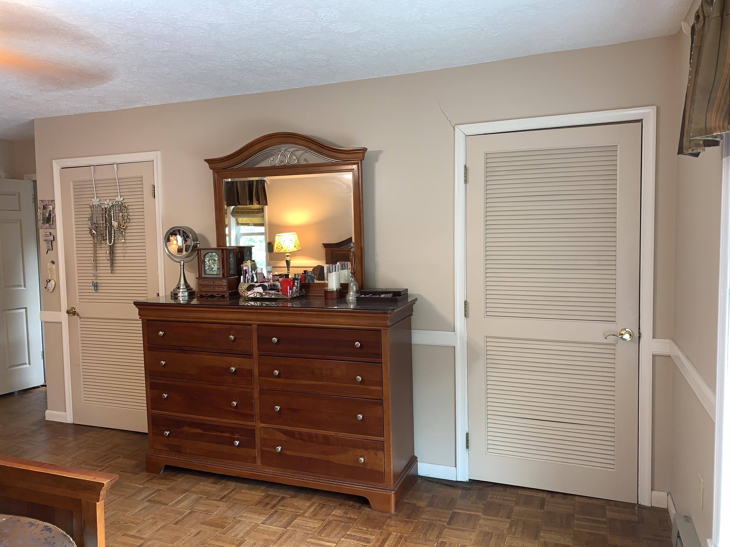 3205 Ely Court Bushkill, PA 18324 - Photo 36 of 80 a room with a dresser and a mirror