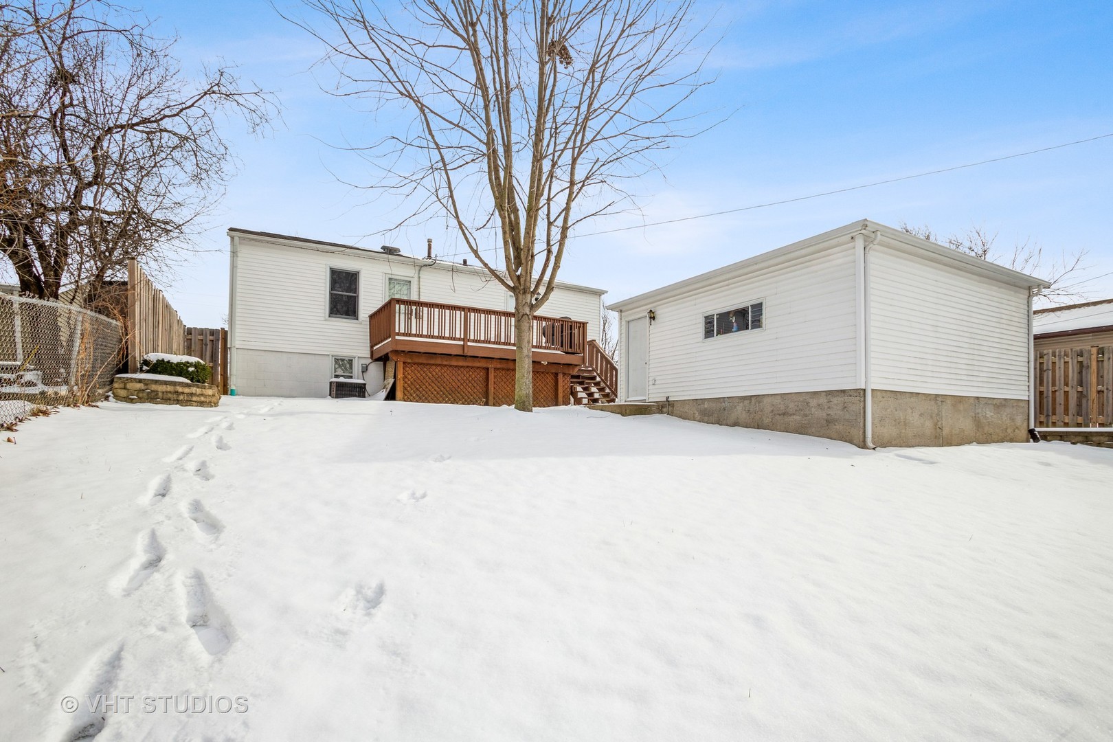 310 South Oltendorf Road Streamwood, IL 60107 - Photo 13 of 13 a large white house with a snow in front of it