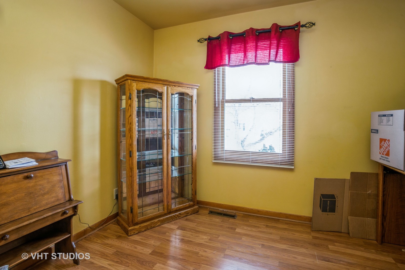 310 South Oltendorf Road Streamwood, IL 60107 - Photo 8 of 13 a view of a room with wooden floor and small cabinet