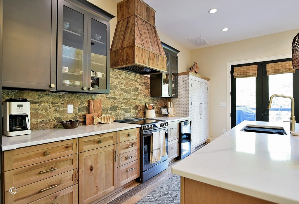 299 Coldiviees Road Hamilton, GA 31811 - Photo 14 of 55 a kitchen with stainless steel appliances granite countertop a sink a stove and cabinets