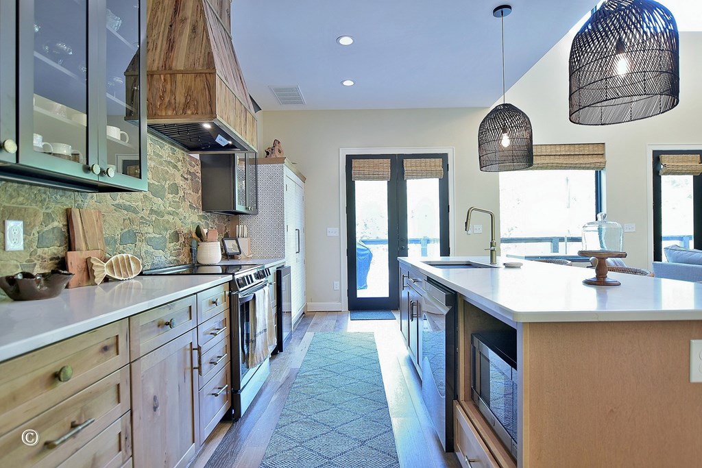 299 Coldiviees Road Hamilton, GA 31811 - Photo 15 of 55 a kitchen with stainless steel appliances a sink stove and cabinets