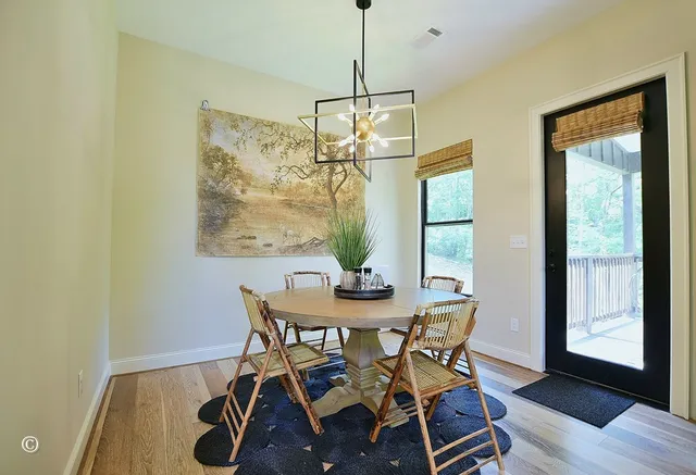 a spacious bathroom with stainless steel appliances a sink and a mirror