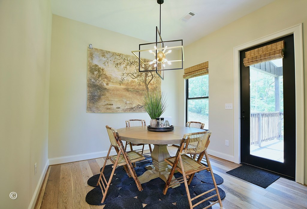 299 Coldiviees Road Hamilton, GA 31811 - Photo 16 of 55 a dining room with furniture a chandelier and wooden floor