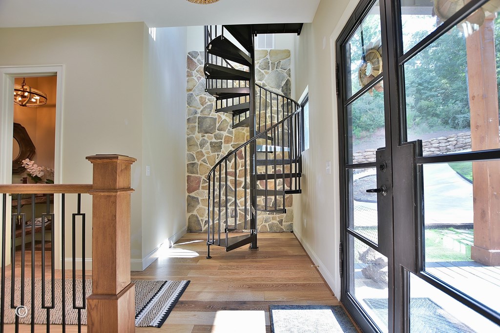299 Coldiviees Road Hamilton, GA 31811 - Photo 32 of 55 a view of staircase with wooden floor and windows