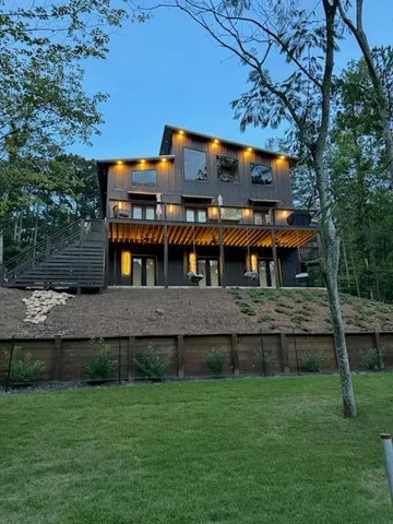an aerial view of house with yard swimming pool and outdoor seating