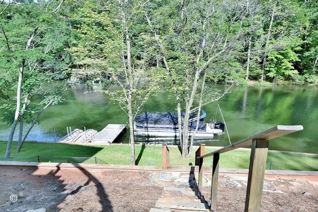 a view of yard with swimming pool and outdoor seating