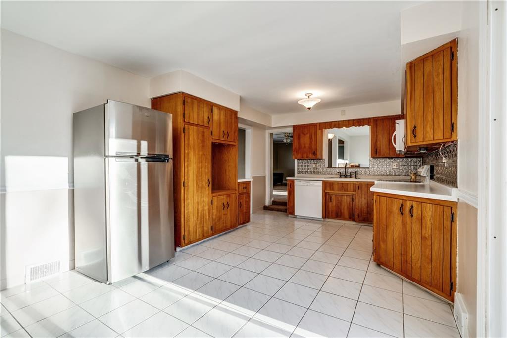 1601 Powers Run Road Pittsburgh, PA 15238 - Photo 4 of 25 The kitchen had sliding door access to back deck.