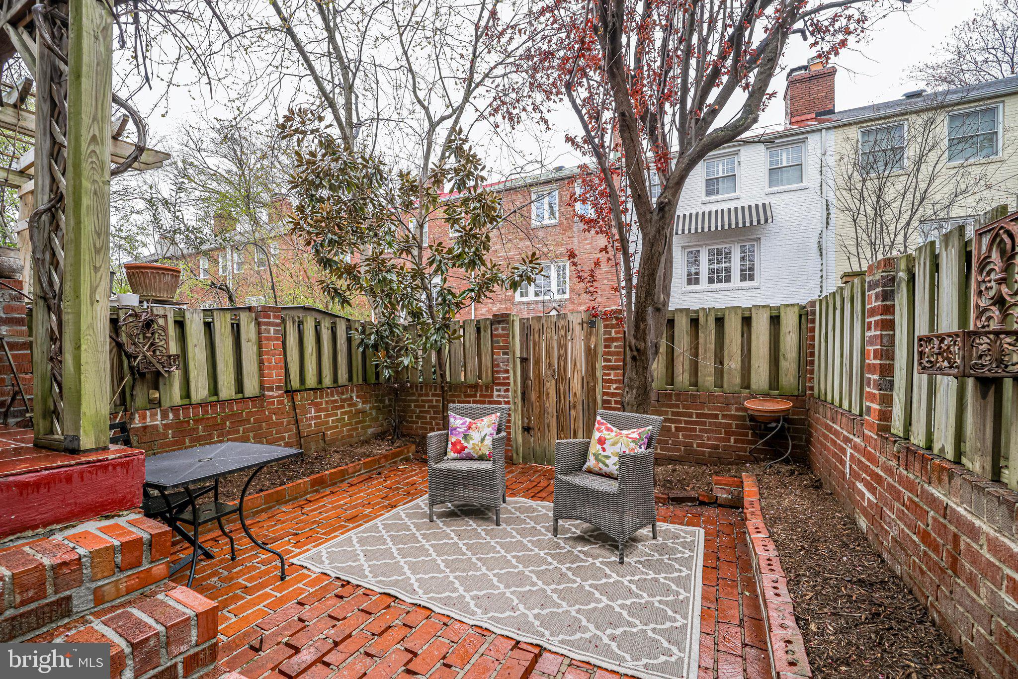 1126 Portner Road Alexandria, VA 22314 - Photo 13 of 26 Brick patio with surrounding flower beds