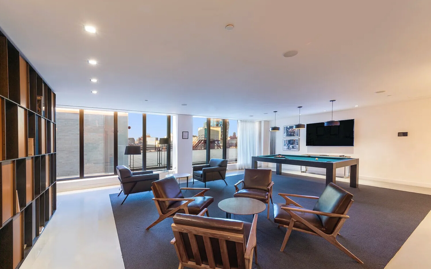 242 Broome Street, Unit 10B Manhattan, NY 10002 - Photo 8 of 10 a living room with fireplace furniture and a flat screen tv