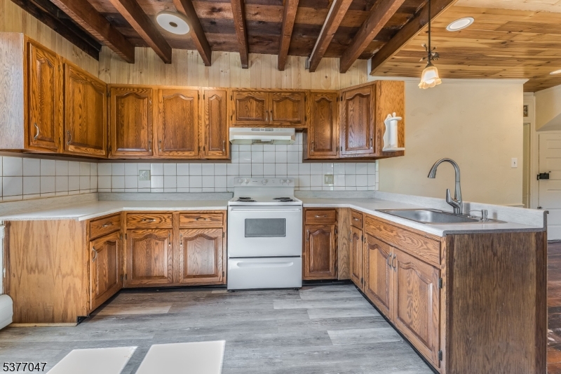 a kitchen with stainless steel appliances granite countertop a sink and cabinets
