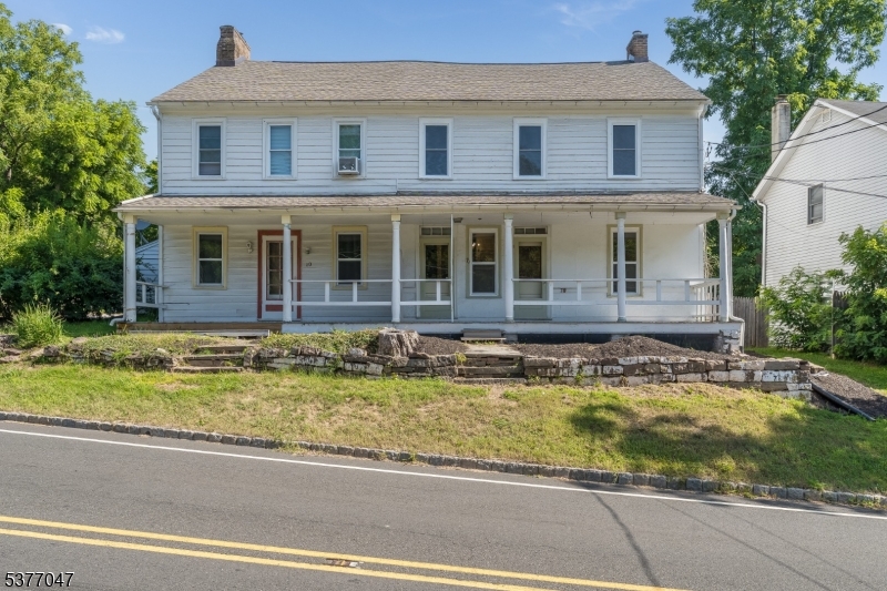 7080 Lt York-mtpleasant Milford, NJ 08848 - Photo 2 of 30 a front view of a house with swimming pool
