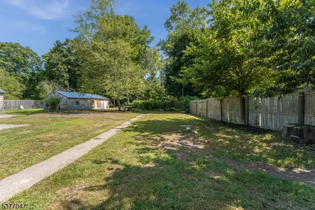 a house with swimming pool in front of it