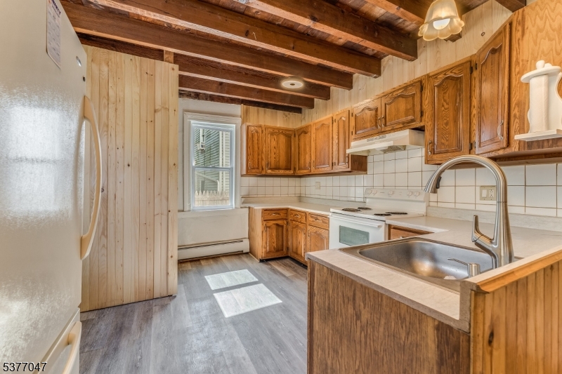 7080 Lt York-mtpleasant Milford, NJ 08848 - Photo 5 of 30 a kitchen with a sink a refrigerator and cabinets