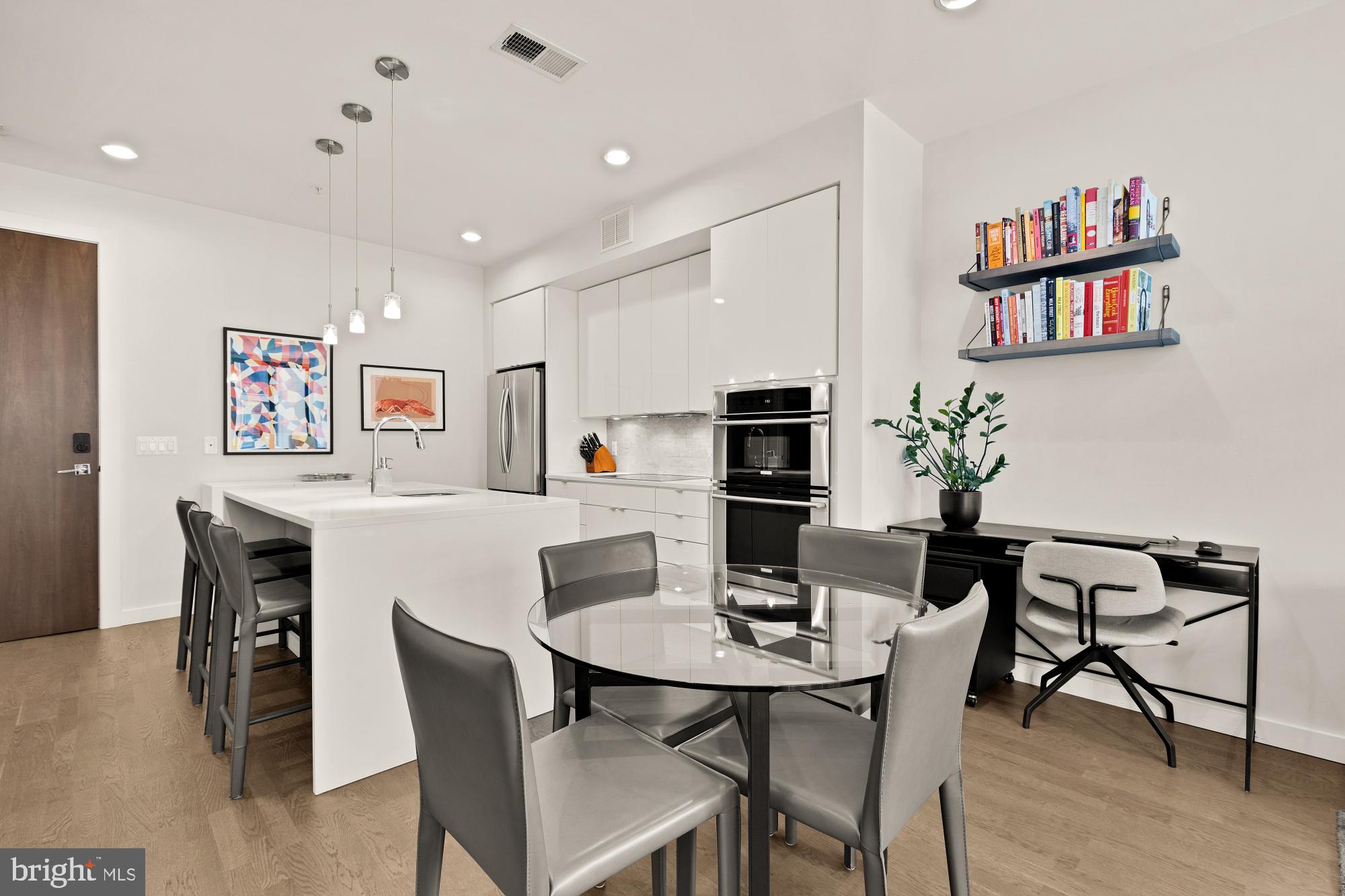 1405 W Street Northwest, Unit 203 Washington, DC 20009 - Photo 6 of 20 a view of a dining room with furniture and wooden floor