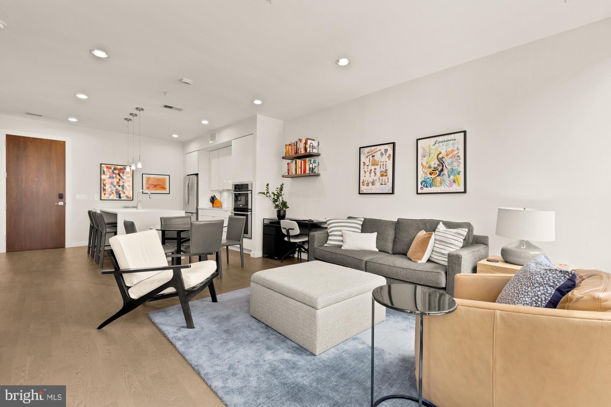 1405 W Street Northwest, Unit 203 Washington, DC 20009 - Photo 8 of 20 a living room with furniture and a table
