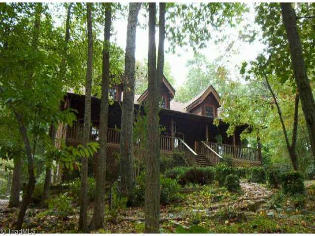 Exterior Front. Superior Log Home Nestled On Wooded Private Lot
