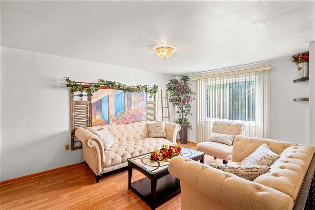 527 Pointview Road Pittsburgh, PA 15227 - Photo 11 of 25 a living room with furniture and a window