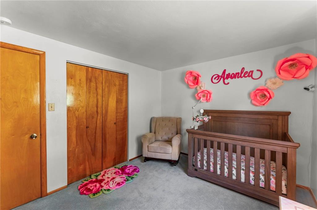 527 Pointview Road Pittsburgh, PA 15227 - Photo 15 of 25 a bedroom with a bed and wooden floor