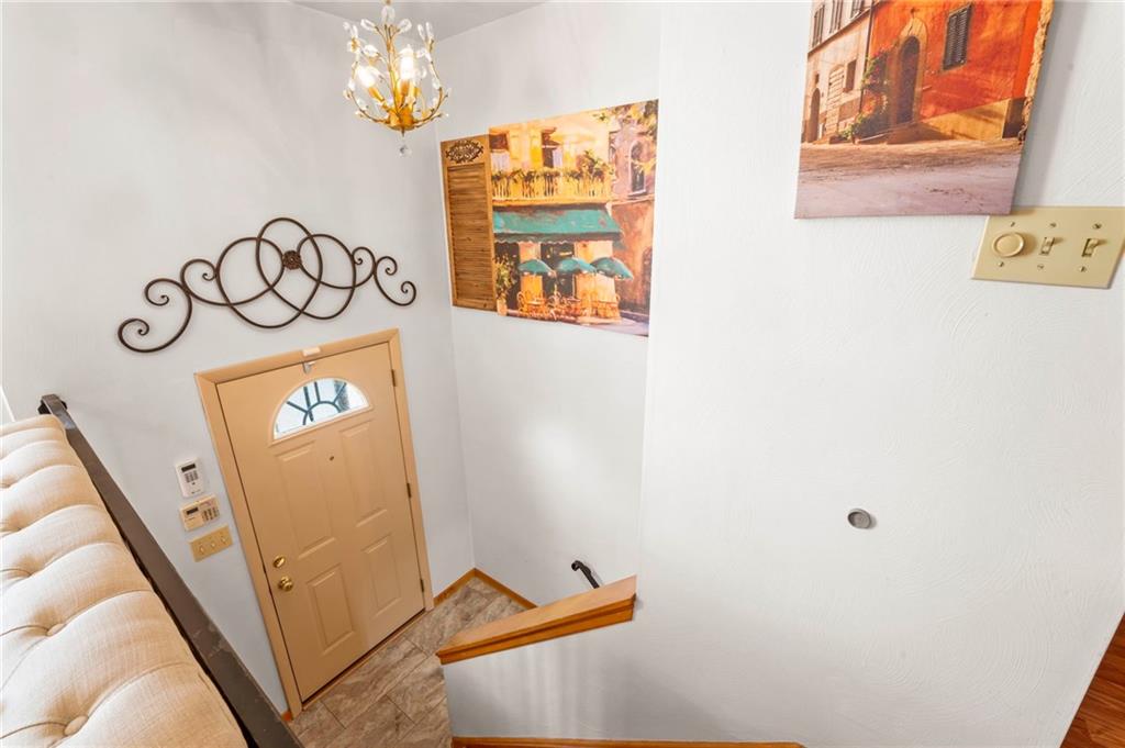 527 Pointview Road Pittsburgh, PA 15227 - Photo 19 of 25 a view of a hallway with paintings on the wall