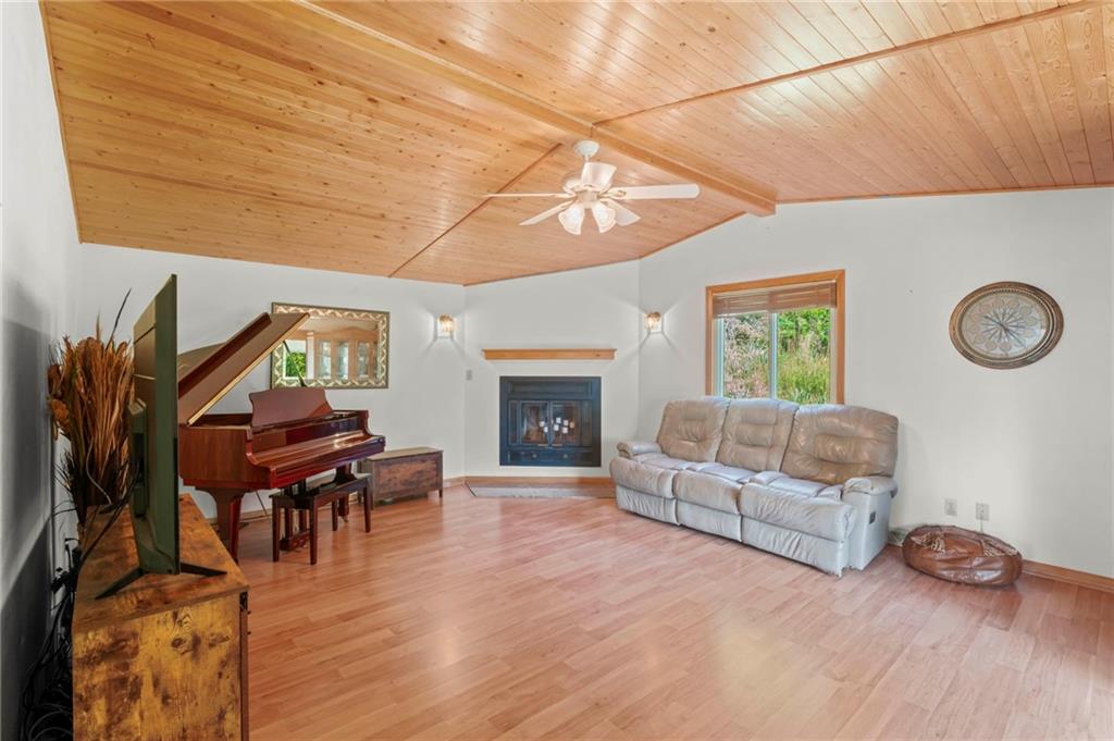 527 Pointview Road Pittsburgh, PA 15227 - Photo 4 of 25 a living room with furniture and a fireplace