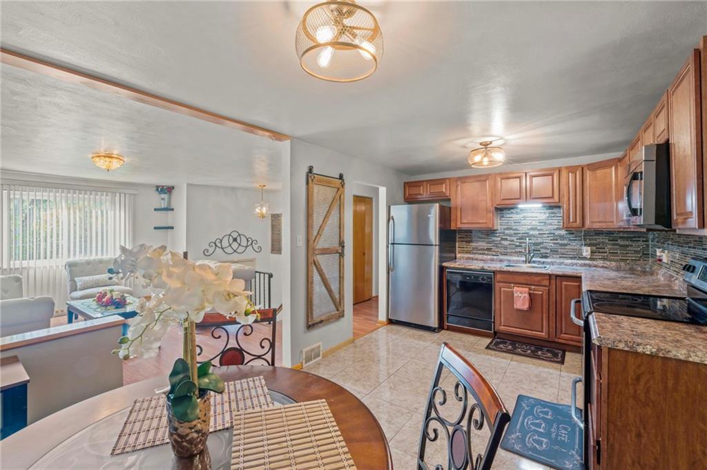 527 Pointview Road Pittsburgh, PA 15227 - Photo 7 of 25 a spacious bathroom with a granite countertop sink a mirror and shower